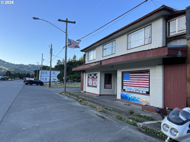 432 2nd Ave, Powers, OR 97466 - view of asphalt street with sidewalks, curbs, and street lighting