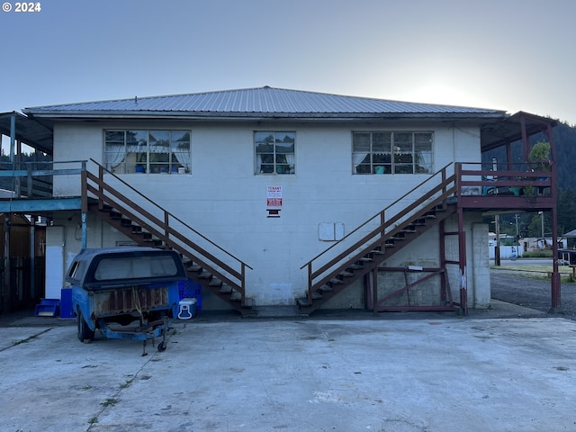432 2nd Ave, Powers, OR 97466 - back of property with stairway, concrete block siding, and metal roof