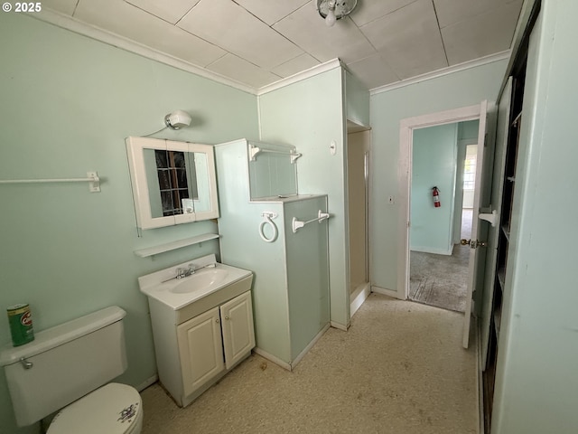 432 2nd Ave, Powers, OR 97466 - bathroom with vanity, toilet, and ornamental molding