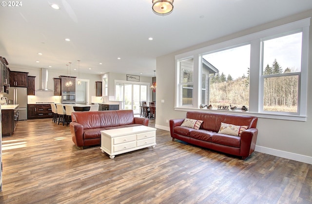 living room with dark hardwood / wood-style flooring