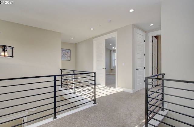 hallway with light carpet