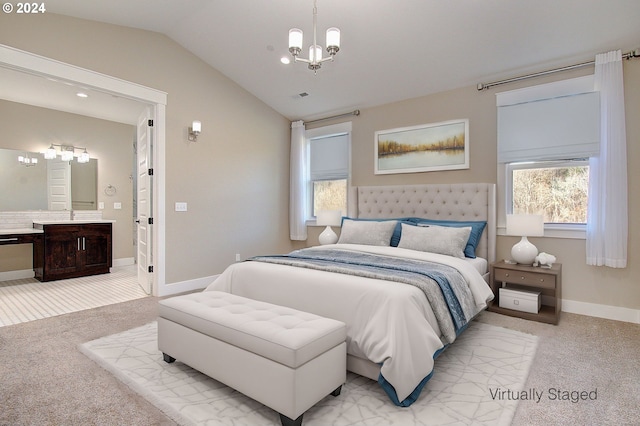 carpeted bedroom with a chandelier and vaulted ceiling