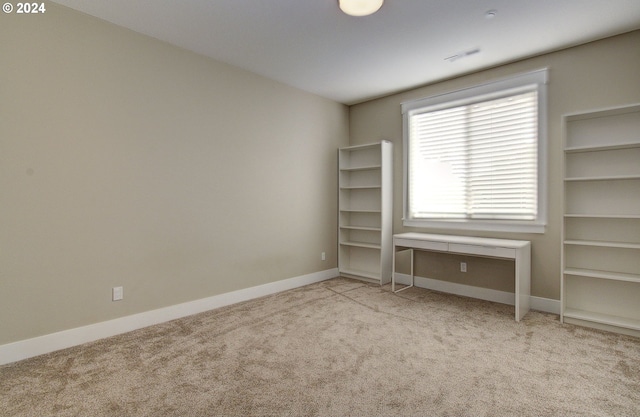 unfurnished bedroom with light carpet