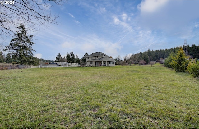 view of yard with a rural view