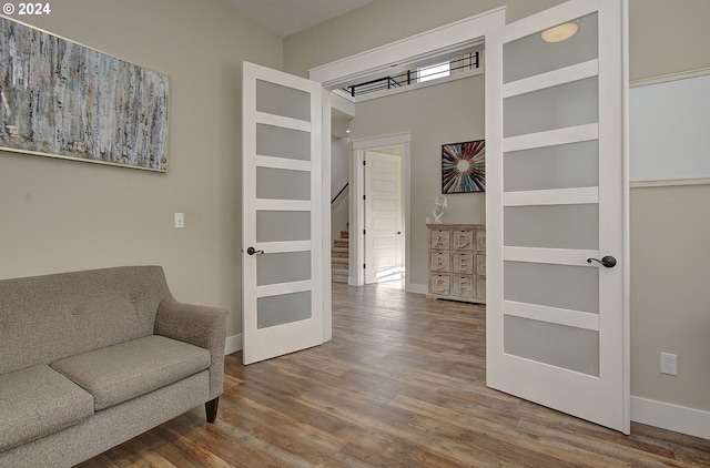 living area with hardwood / wood-style flooring