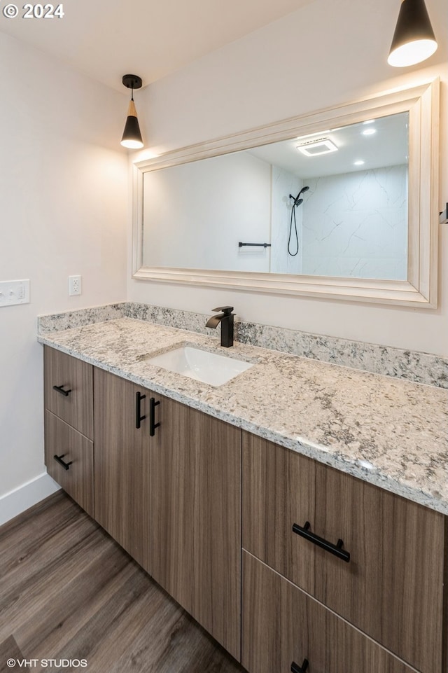 bathroom featuring vanity and hardwood / wood-style flooring