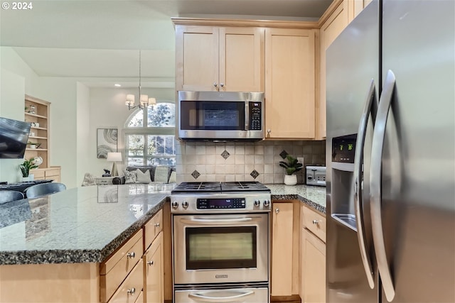 kitchen featuring decorative backsplash, light brown cabinets, stainless steel appliances, and an inviting chandelier