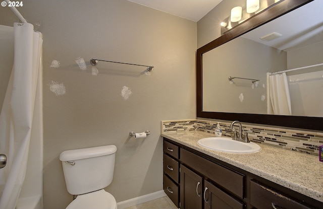 bathroom featuring backsplash, curtained shower, vanity, and toilet