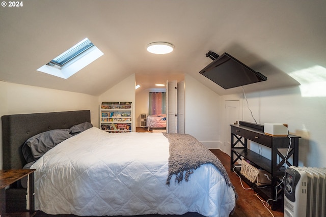 bedroom with dark hardwood / wood-style flooring and vaulted ceiling