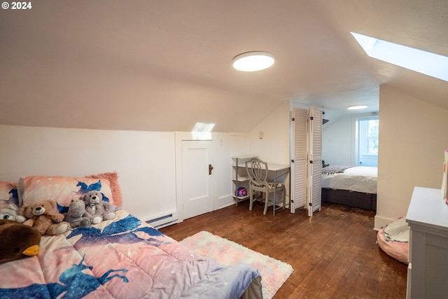 bedroom featuring baseboard heating, dark hardwood / wood-style flooring, and vaulted ceiling with skylight