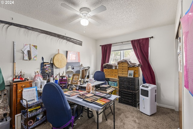 office featuring ceiling fan, carpet floors, and a textured ceiling