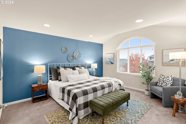 carpeted bedroom featuring vaulted ceiling