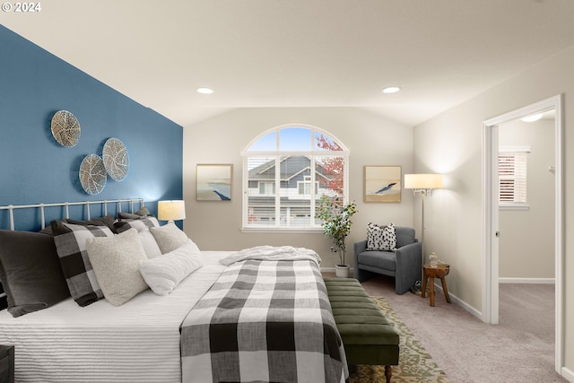 carpeted bedroom featuring lofted ceiling