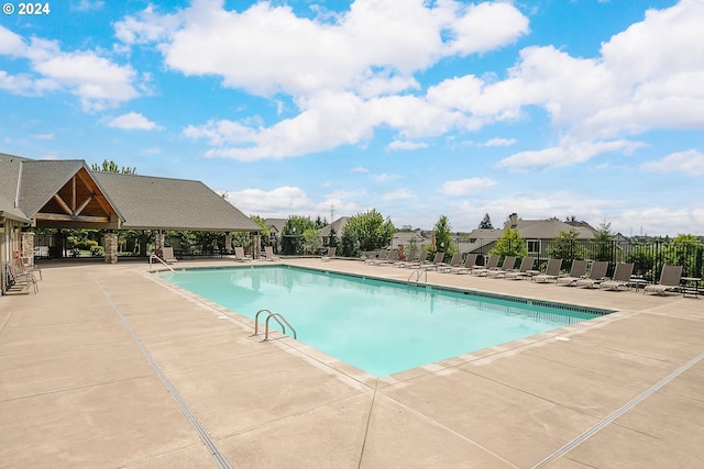 view of swimming pool with a patio