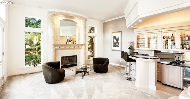 living room with light carpet, ornamental molding, and a tile fireplace