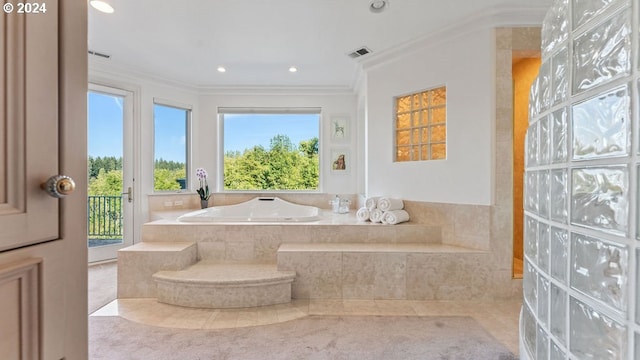 bathroom with tiled tub, plenty of natural light, tile patterned floors, and crown molding