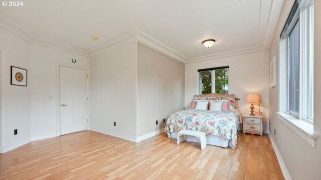 carpeted bedroom featuring ornamental molding and access to exterior