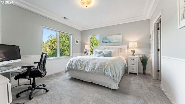 bedroom featuring light carpet and ornamental molding