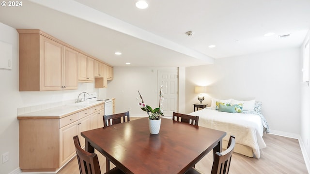 home office with light carpet and crown molding