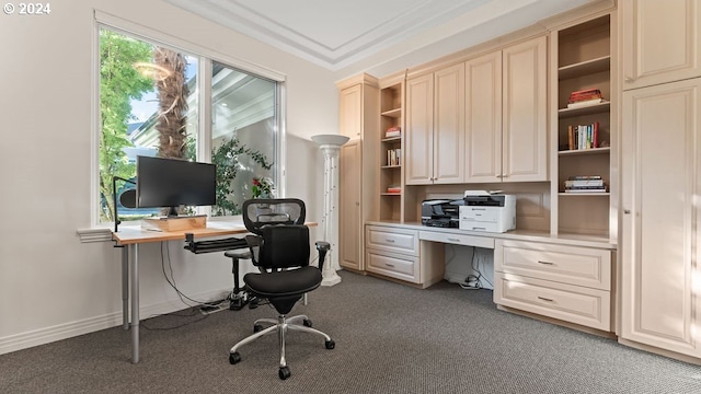 carpeted home office featuring crown molding