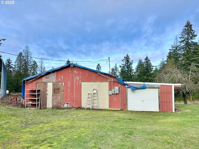 view of outbuilding featuring a lawn