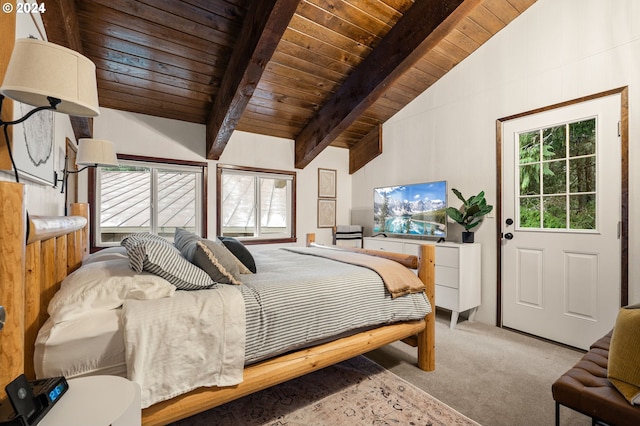 bedroom with lofted ceiling with beams, wood ceiling, and light carpet