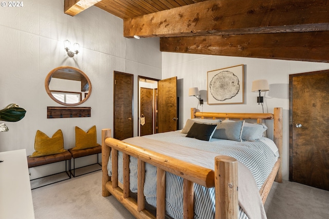 bedroom featuring wooden ceiling, light carpet, and beam ceiling