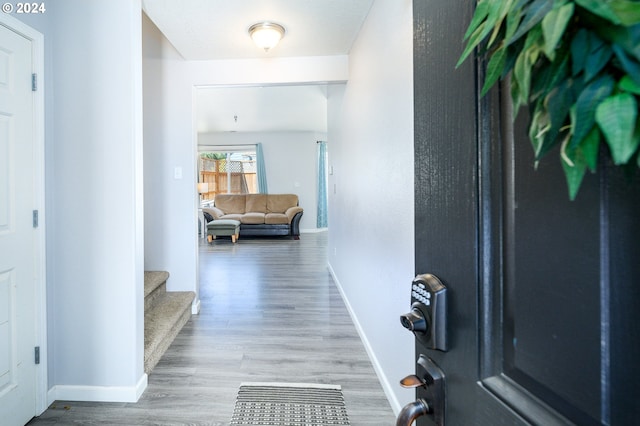 hall with light hardwood / wood-style floors