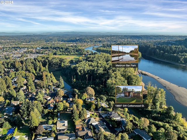 drone / aerial view with a water view