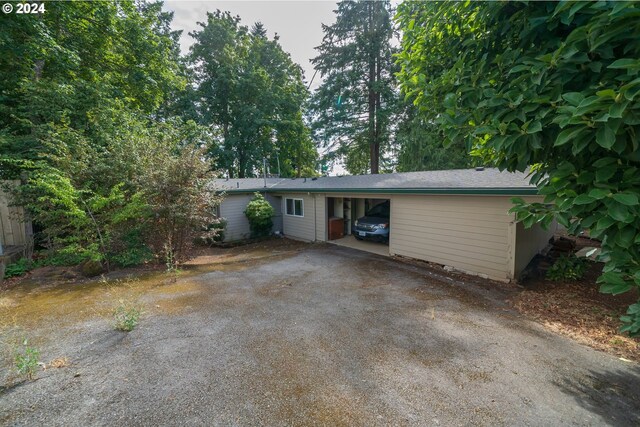 view of front facade with a carport