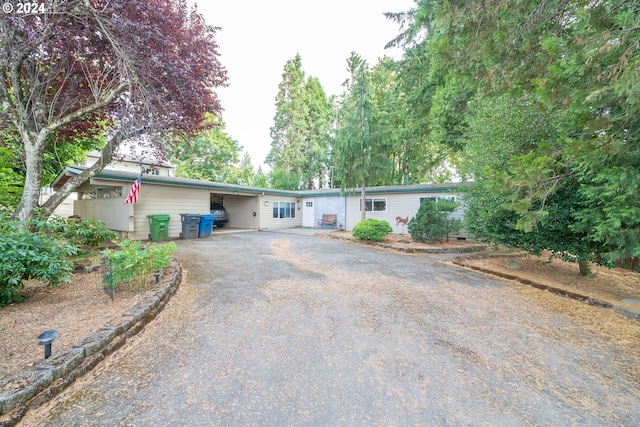 ranch-style home with a carport