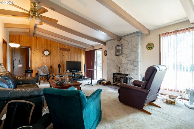 living room featuring plenty of natural light, ceiling fan, carpet floors, and lofted ceiling with beams