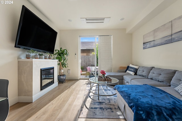 living room with light hardwood / wood-style flooring