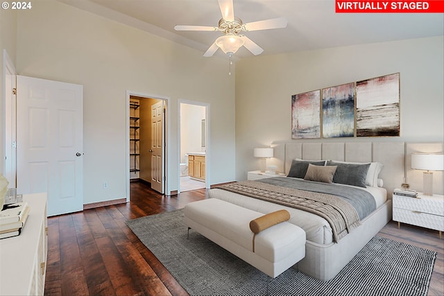 bedroom featuring ceiling fan, dark hardwood / wood-style floors, connected bathroom, and high vaulted ceiling