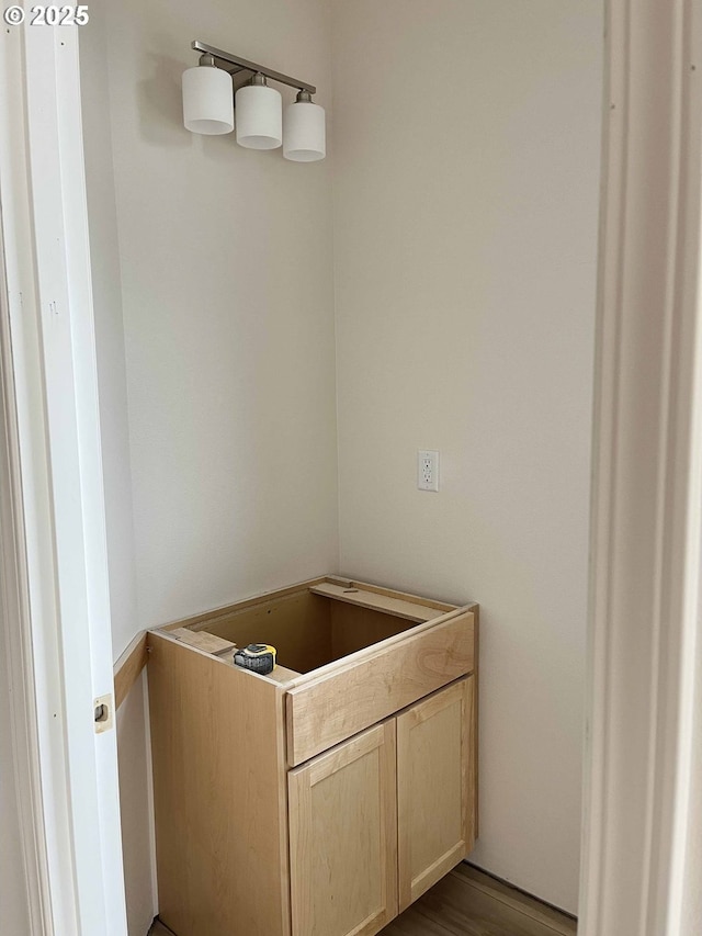 bathroom with hardwood / wood-style flooring