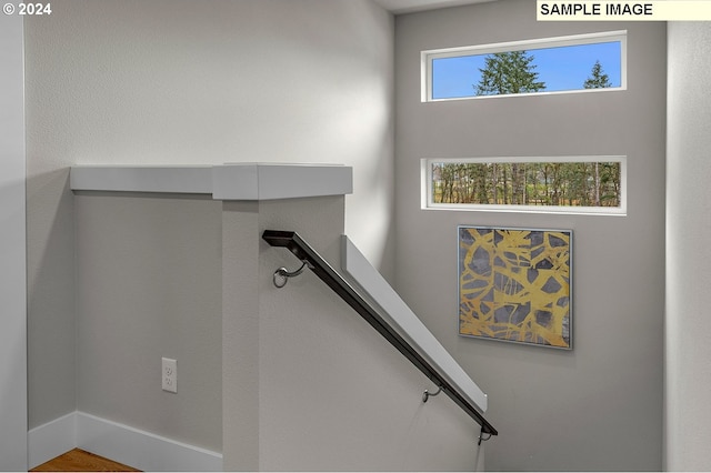 stairway featuring hardwood / wood-style flooring