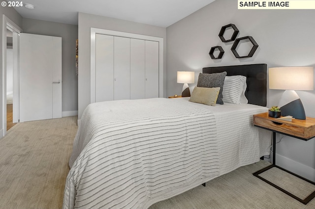 carpeted bedroom featuring a closet