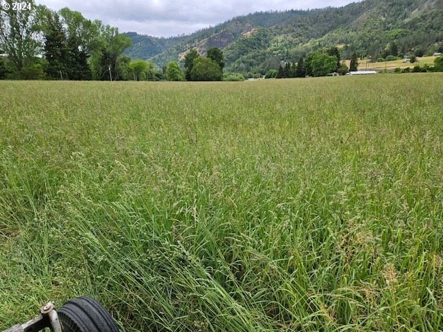 view of mountain feature featuring a rural view