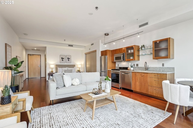 living room featuring dark wood-style floors and visible vents