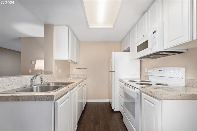 kitchen featuring dark hardwood / wood-style floors, white cabinetry, white appliances, and sink