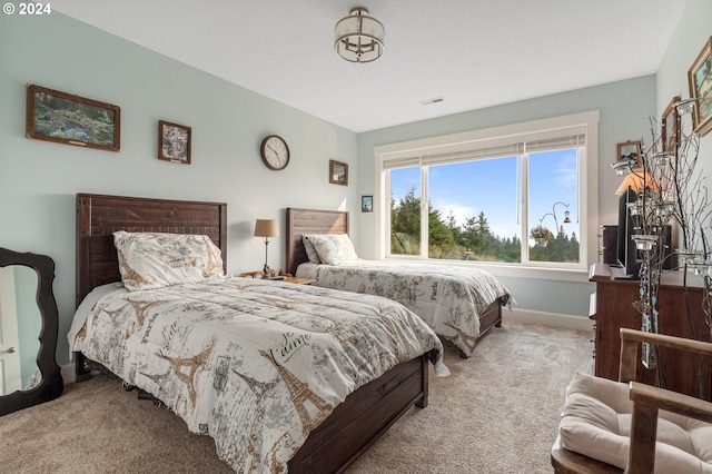 bedroom with light carpet