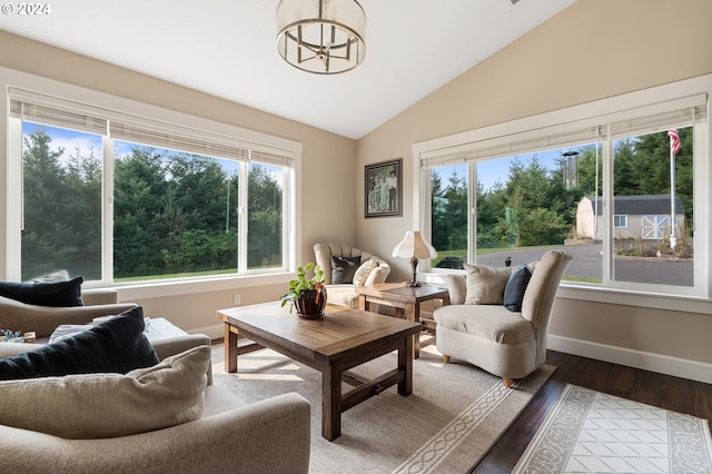 living room with dark wood-type flooring and vaulted ceiling