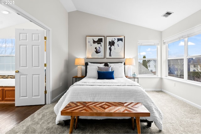 bedroom featuring lofted ceiling