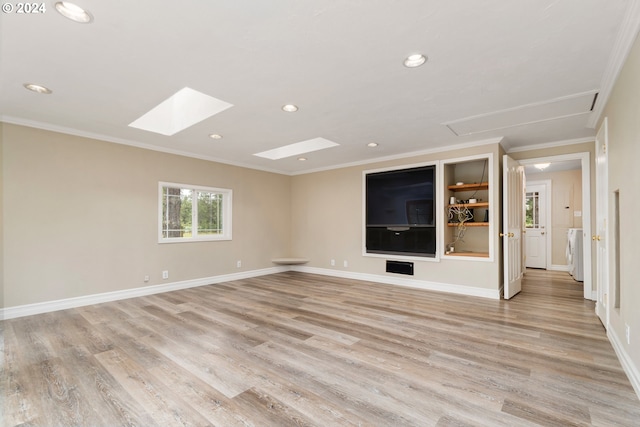 unfurnished living room featuring a skylight, crown molding, recessed lighting, light wood-type flooring, and baseboards