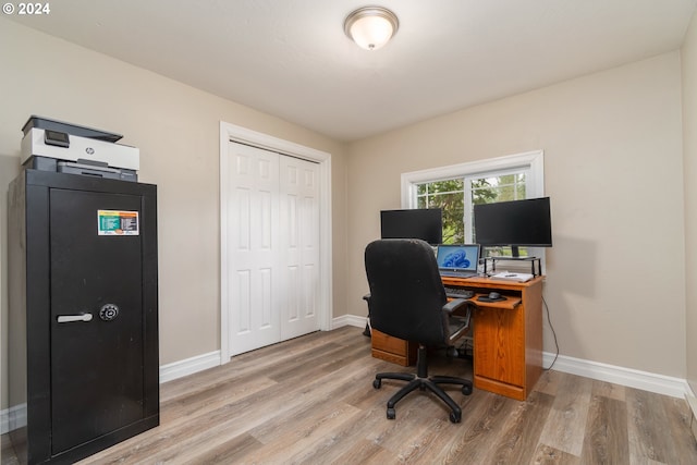 office area featuring baseboards and wood finished floors