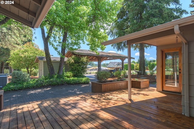 wooden deck featuring a gazebo