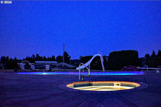 view of pool at night