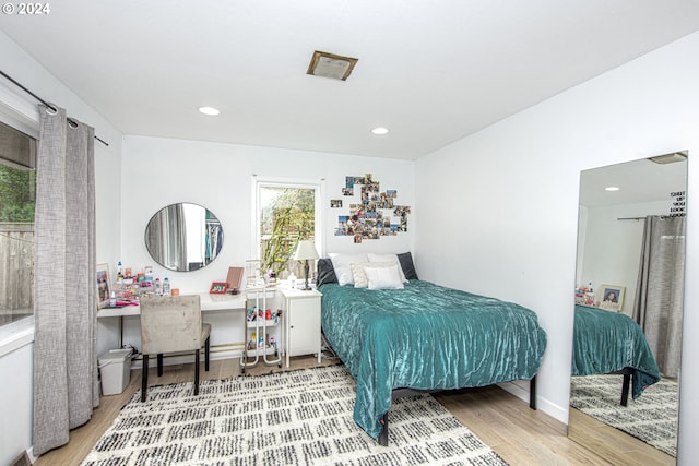 bedroom featuring hardwood / wood-style floors