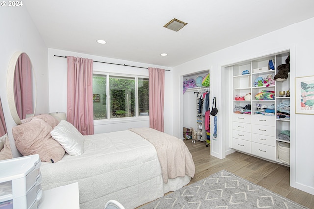 bedroom featuring light hardwood / wood-style flooring and a closet