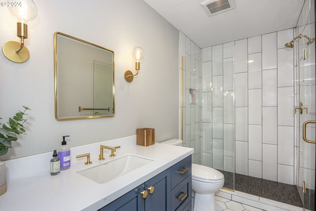 bathroom featuring walk in shower, vanity, toilet, and tile patterned floors